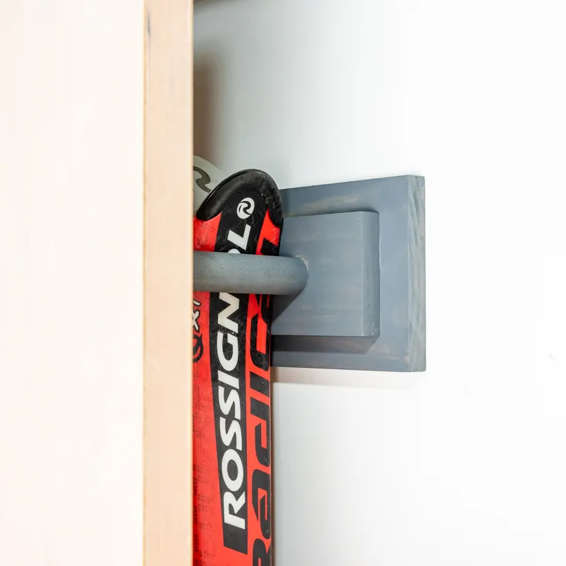 DIY ski rack mounted behind garage door