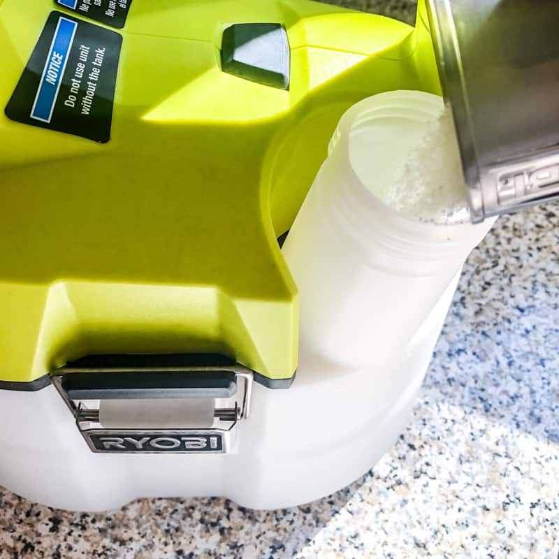 pouring TSP cleanser into Ryobi chemical sprayer