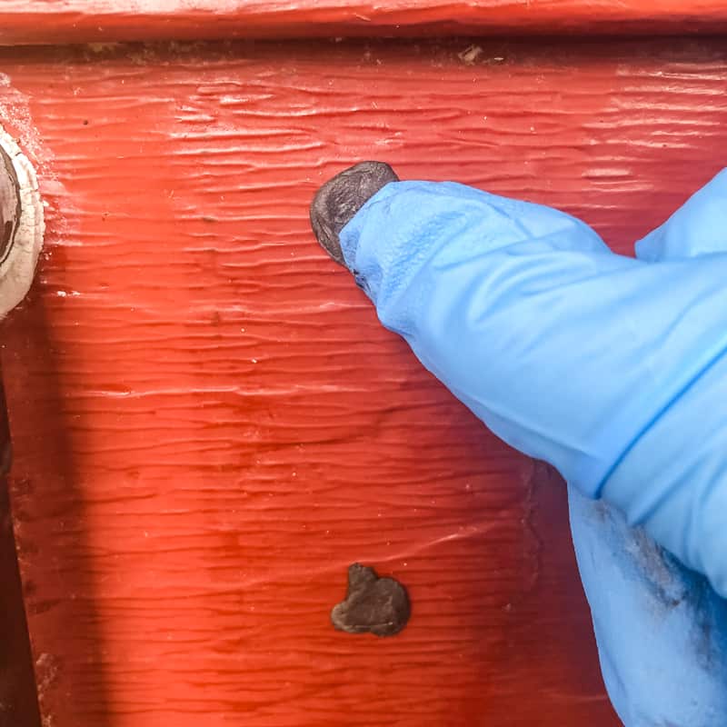 pressing epoxy into aluminum siding holes