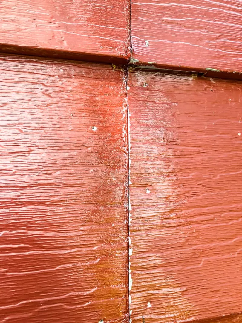 gutter sealant applied to seam in aluminum siding repair