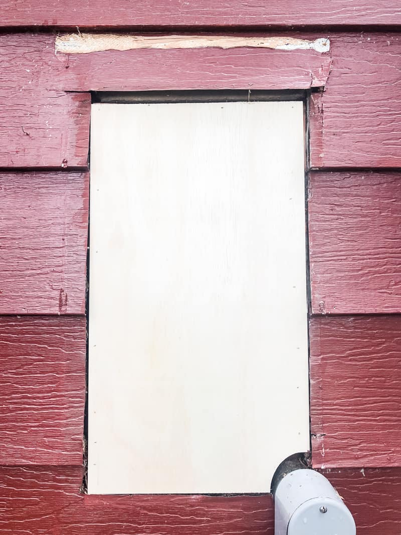 plywood backing in hole in aluminum siding