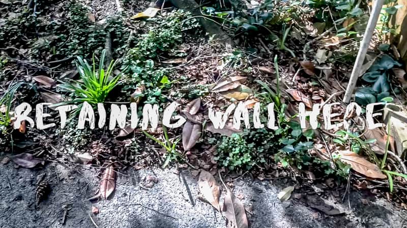 location of retaining wall in garden with eroded soil