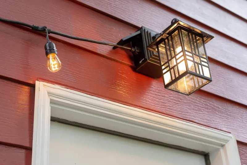 outdoor light with GFCI outlet on side and string lights plugged in