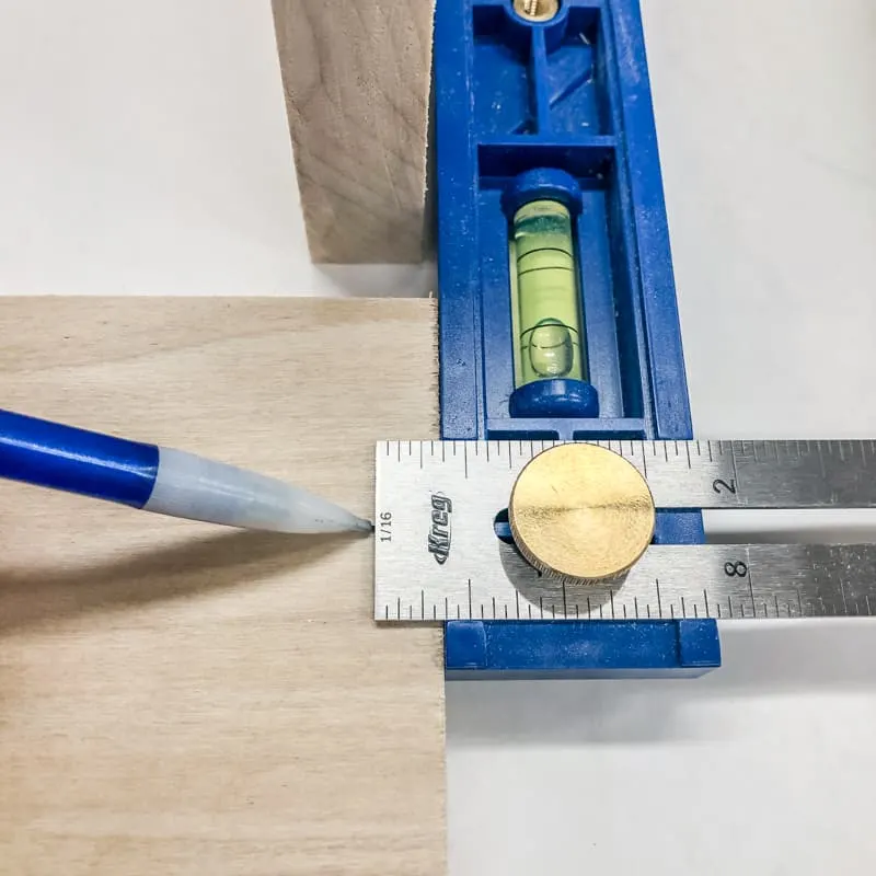 marking center of board for countersink holes