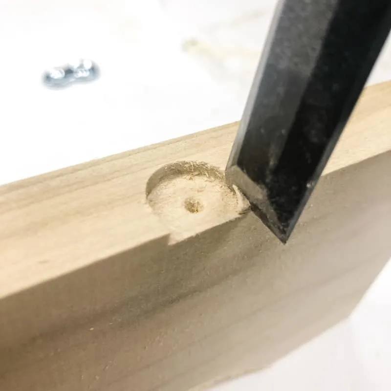 chiseling away corners of slot for table top fastener