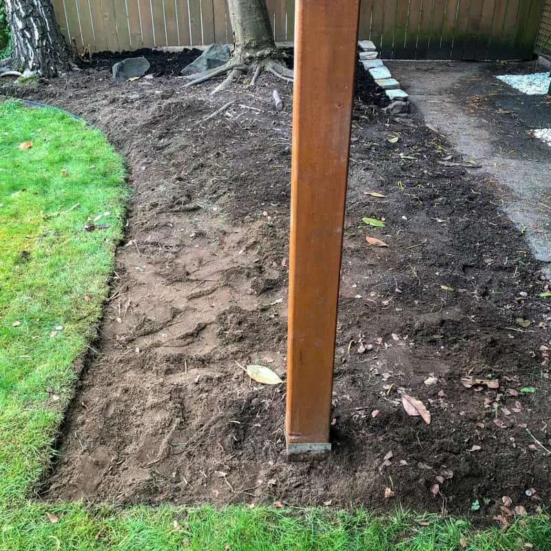 grass removed from pea gravel patio area