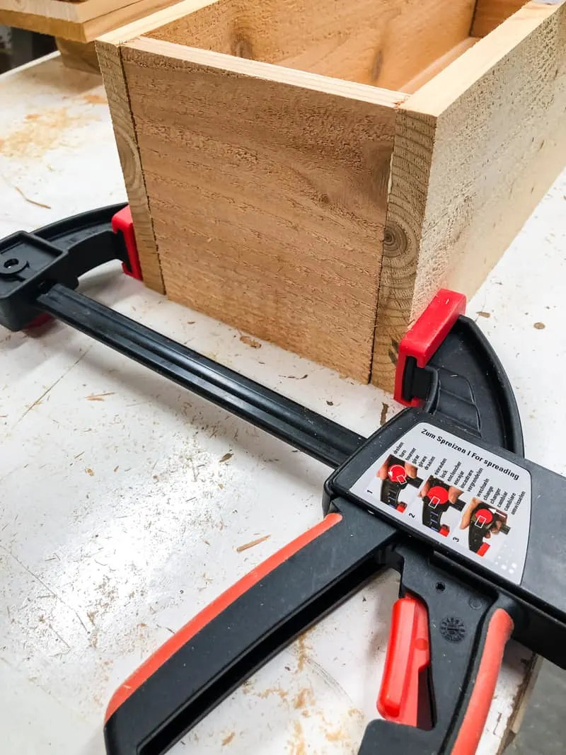 Bessey clamp holding together planter box