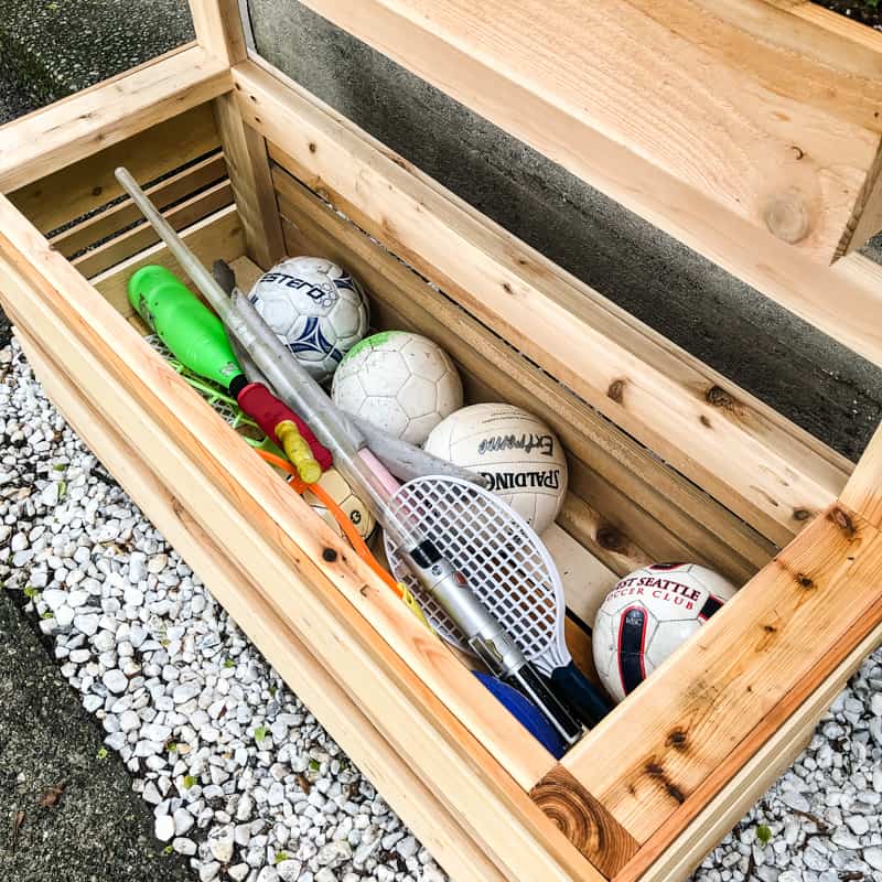 outdoor toys and balls in outdoor toy box