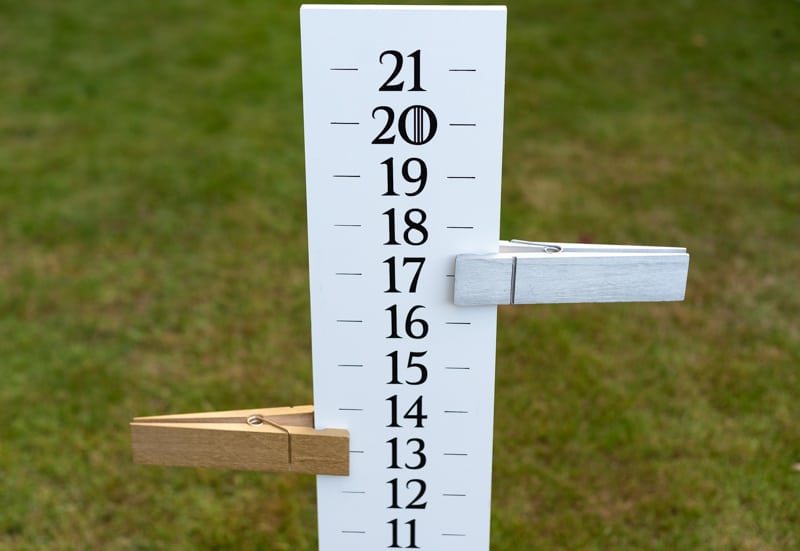 DIY cornhole scoreboard with point markers