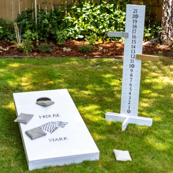 DIY cornhole scoreboard with cornhole board in Game of Thrones theme