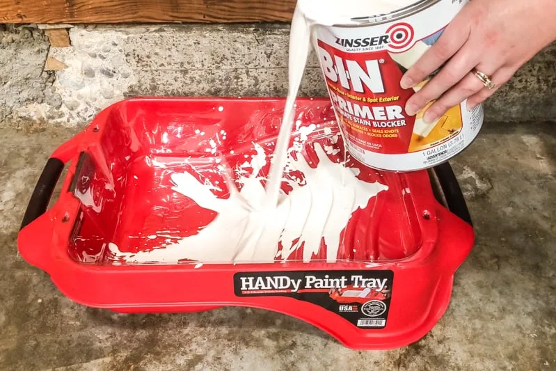 pouring primer into HANDy paint tray