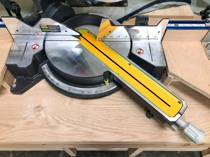 miter saw base set to 45 degrees for mitered cut