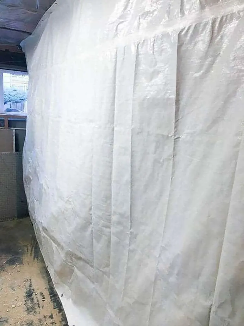 white tarp covering part of a room