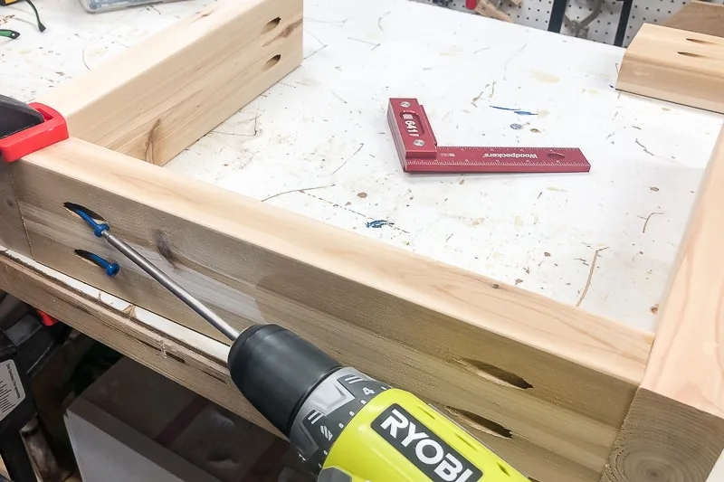 assembling legs of DIY coffee table with pocket hole screws