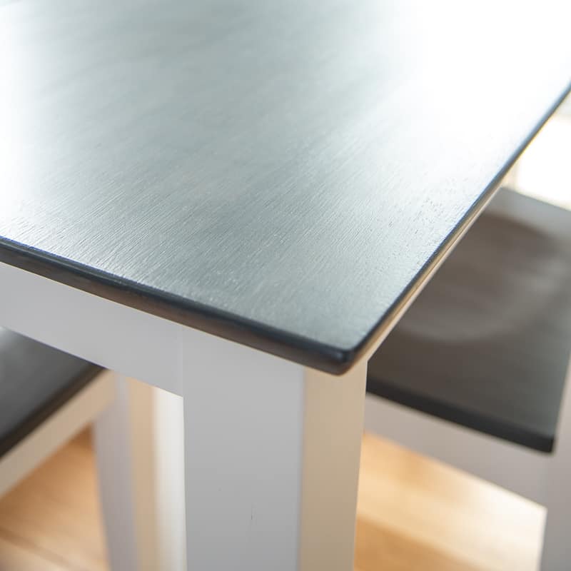 refinished dining table with grey stained top and white legs