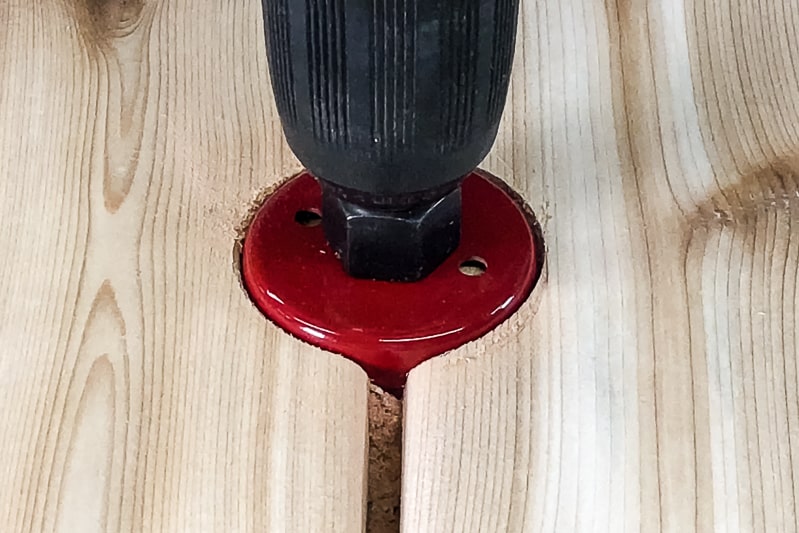 drilling hole for umbrella in top of umbrella stand table with a hole saw