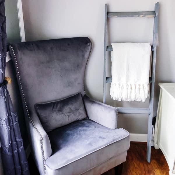 DIY blanket ladder next to armchair