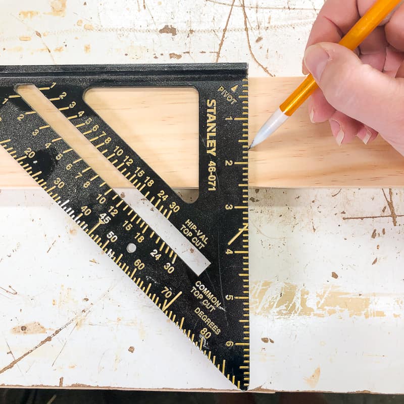 marking cut line on board with a square