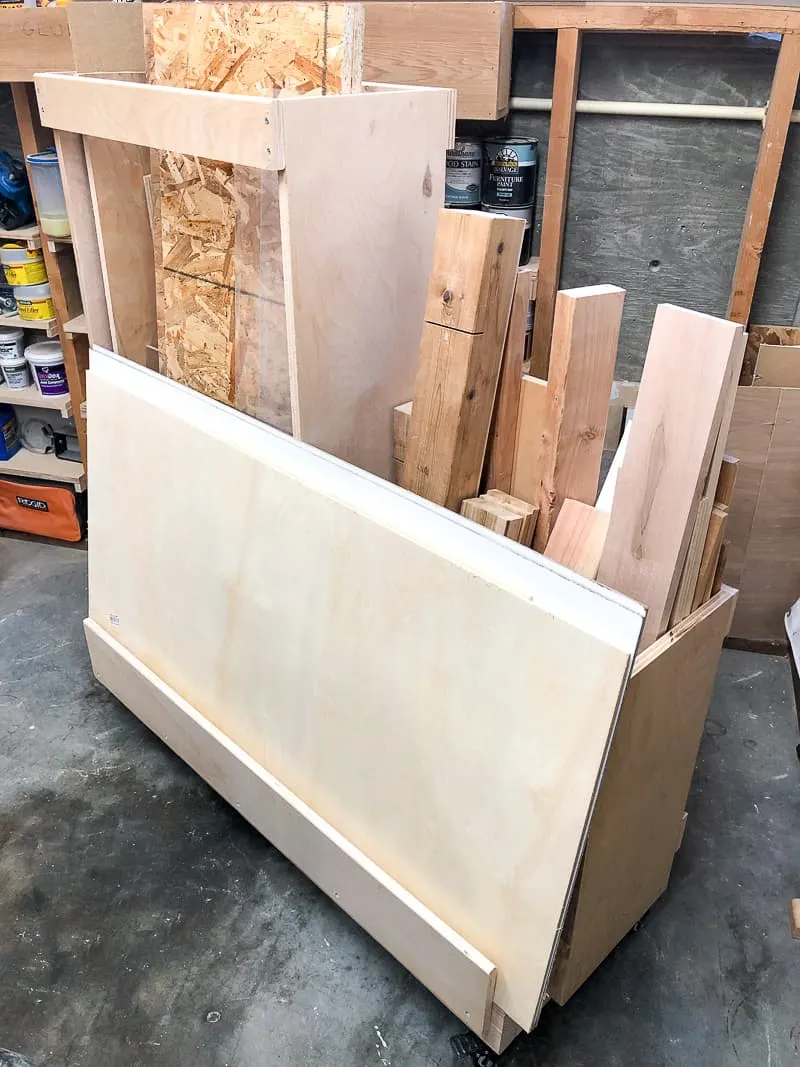 DIY lumber cart with plywood scraps on front