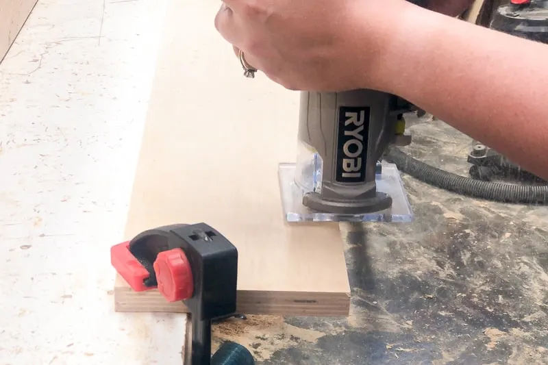 using a trim router with roundover bit on edges of lumber cart slats