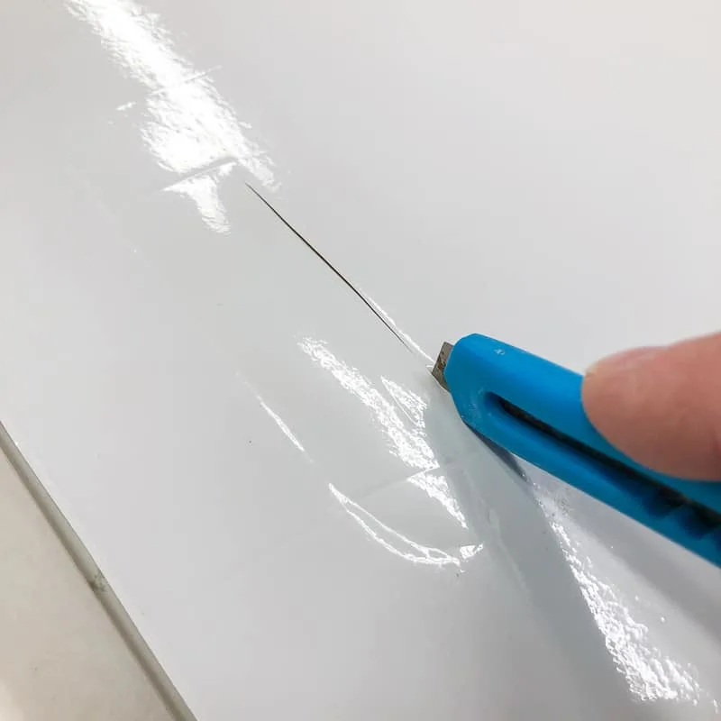cutting hole for cabinet door hardware with a razor blade