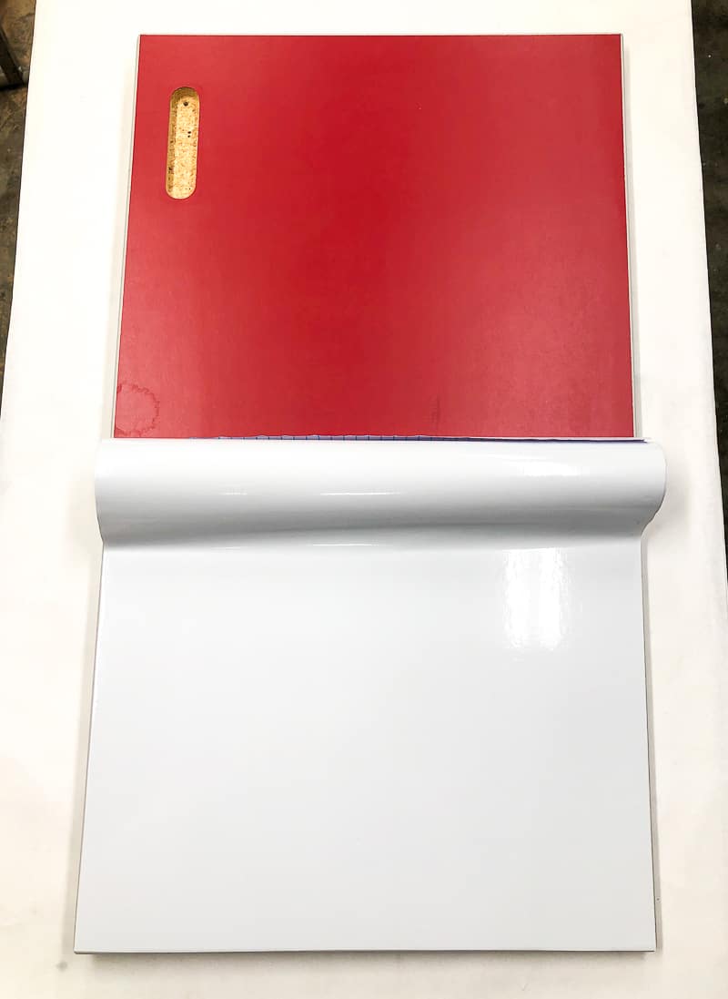 red cabinet door with contact paper applied halfway