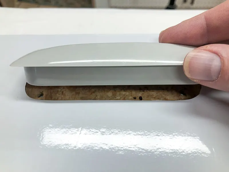reinstalling cabinet door handle through hole in contact paper