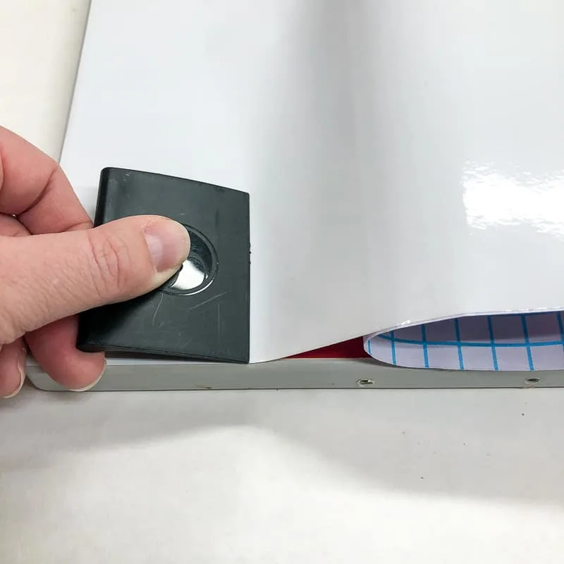 smoothing out air bubbles under contact paper on cabinet door