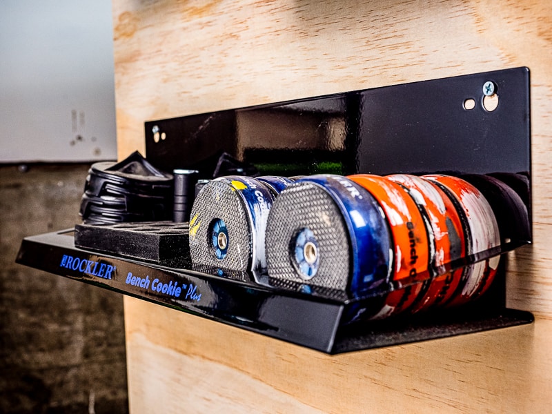 Rockler bench cookie storage rack on side of rolling workbench