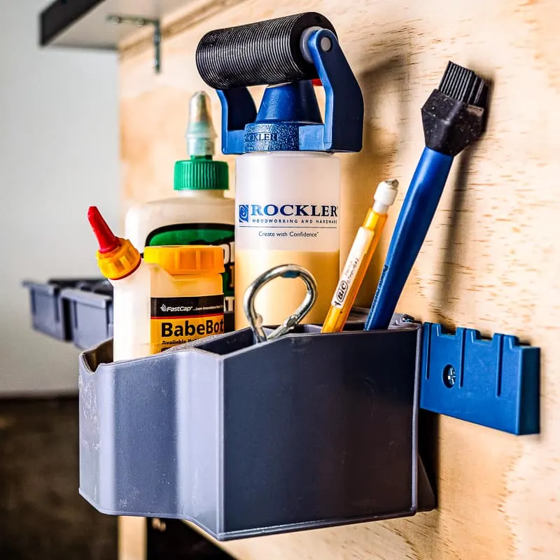 glue caddy and screw bins on side of mobile workbench