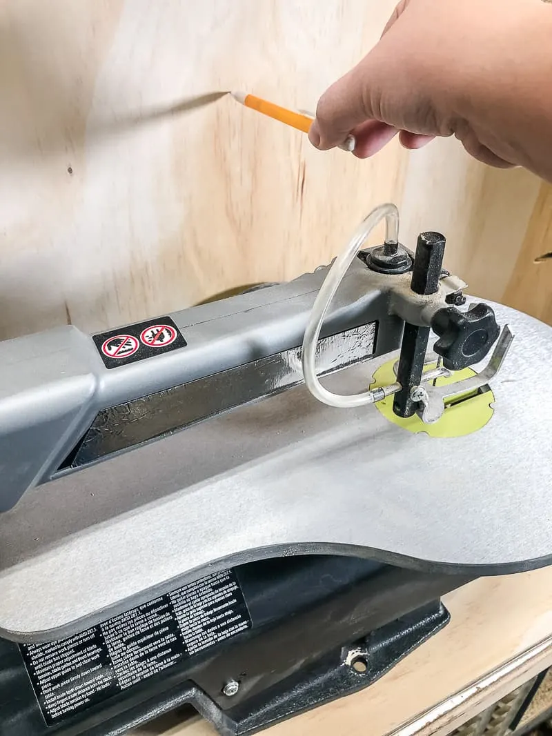 marking height of scroll saw on DIY workbench shelf