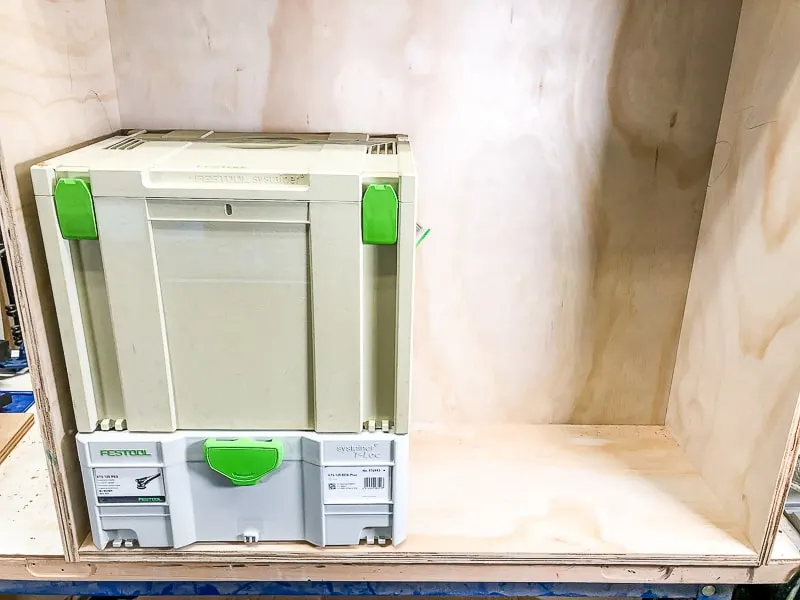 Festool systainers stacked inside DIY workbench