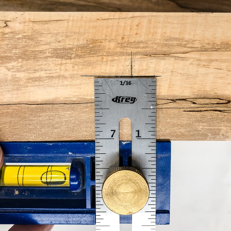 marking position on edge of live edge board for floating shelf hardware bracket