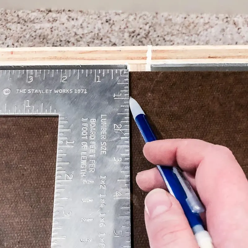 marking shelf location on backing of entertainment center