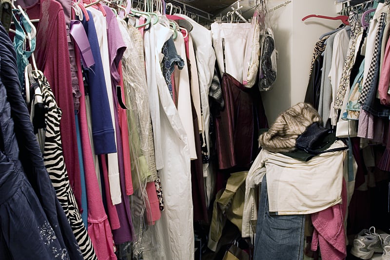 messy closet full of clothes