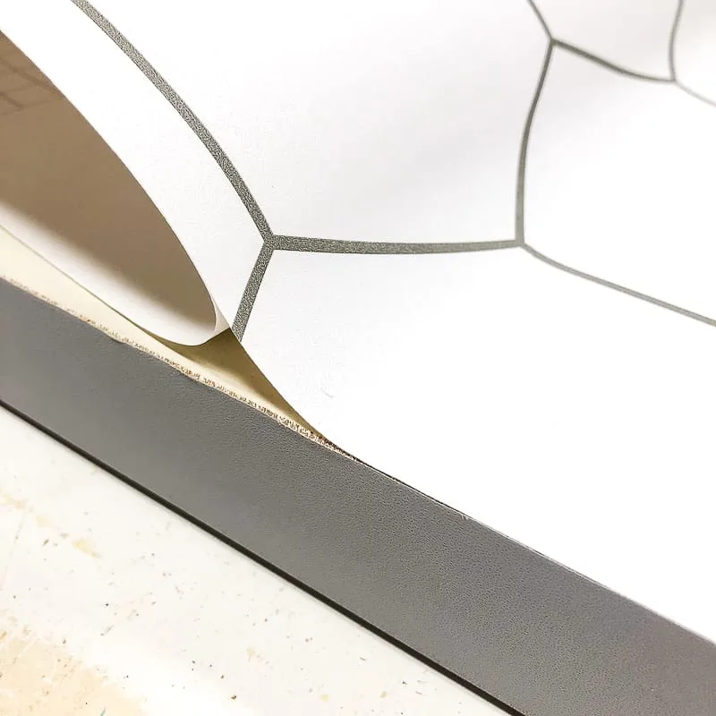 applying hexagon patterned contact paper to bifold door
