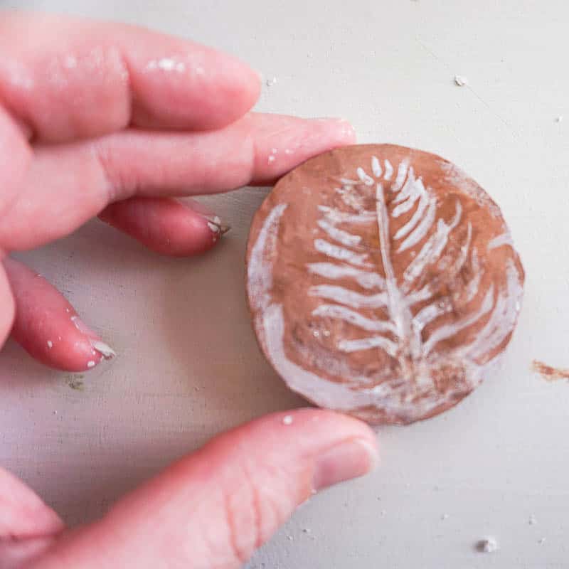 latte design painted on a cardboard circle to be inserted in the DIY Starbucks ornament