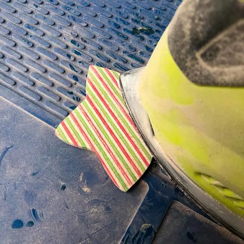 using a corner sander to sand the wooden ornaments