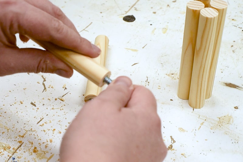 inserting hanger bolts into ends of dowels
