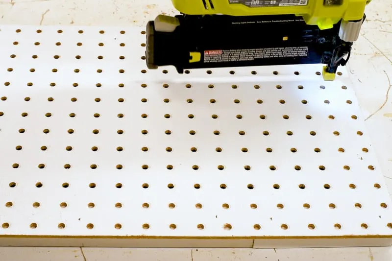 nailing supports for pegboard in place