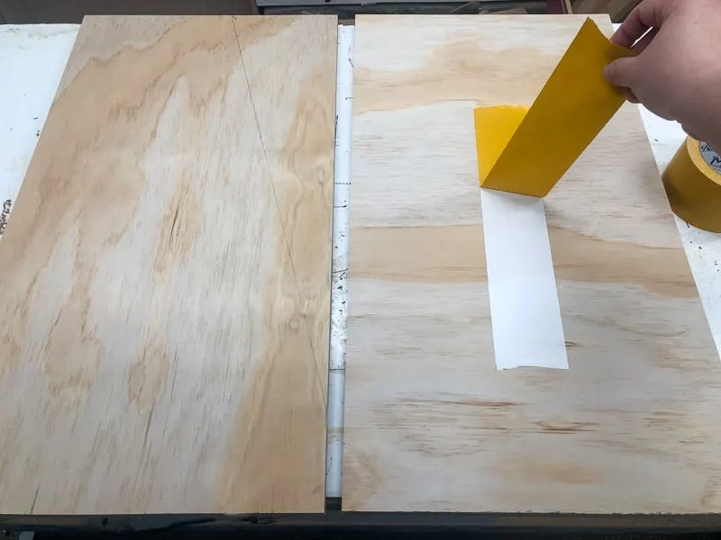 applying double stick tape to bookshelf sides before cutting the angle