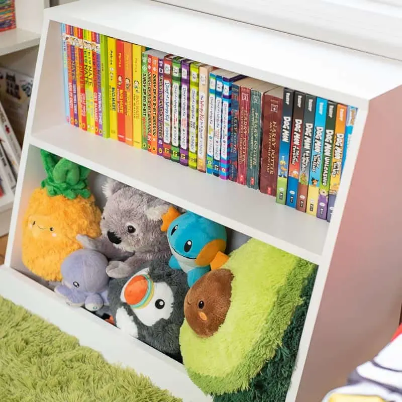 side view of DIY kids bookshelf filled with books and stuffed animals