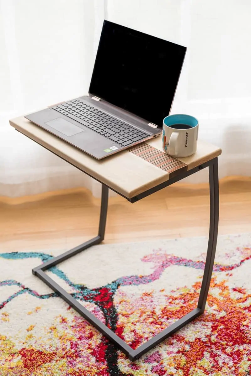 DIY laptop stand top on metal base with laptop and coffee cup