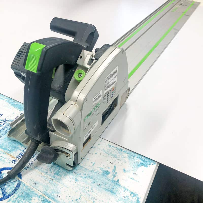 Festool track saw on laminate sheet and foam insulation panel