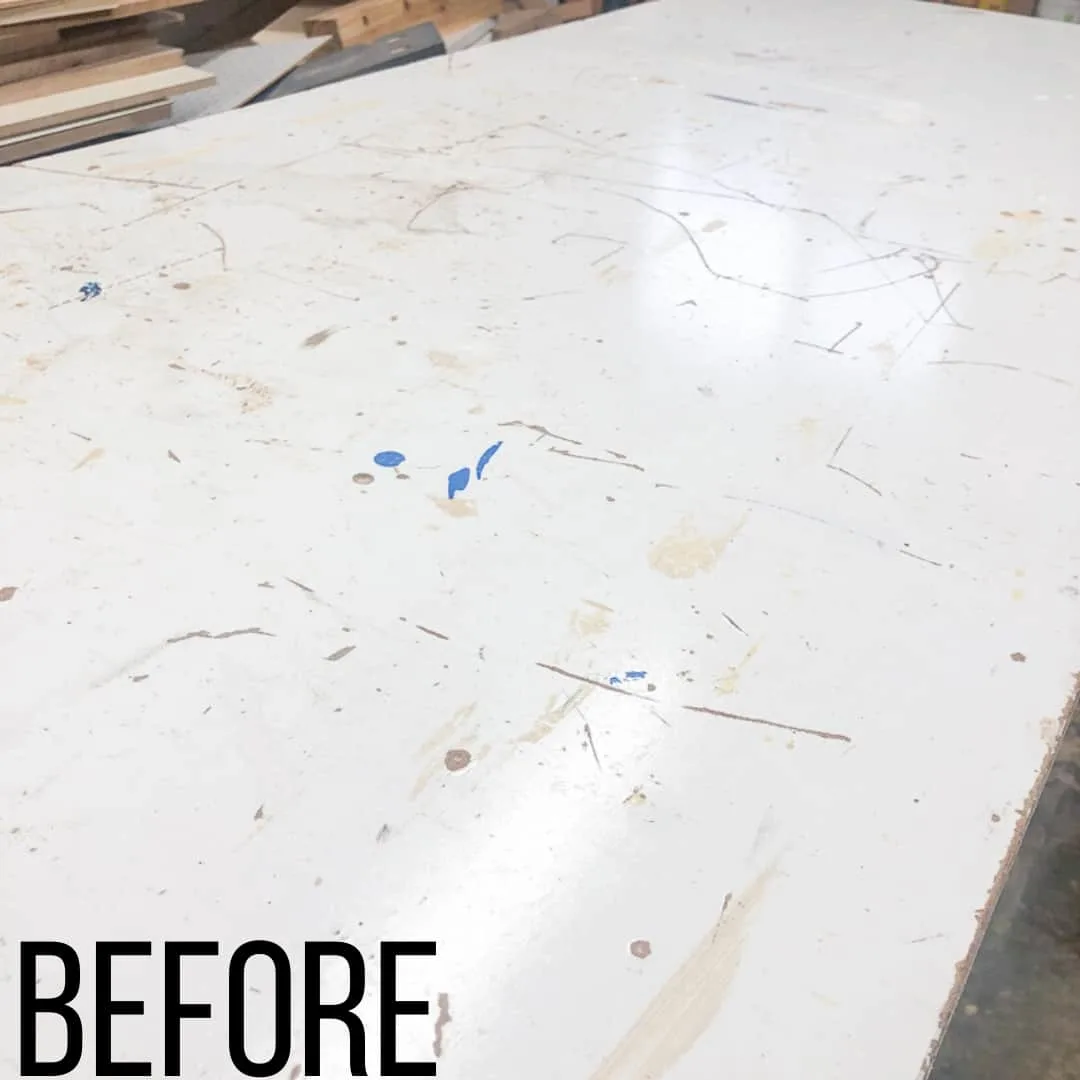 workbench top with scratches and paint drips