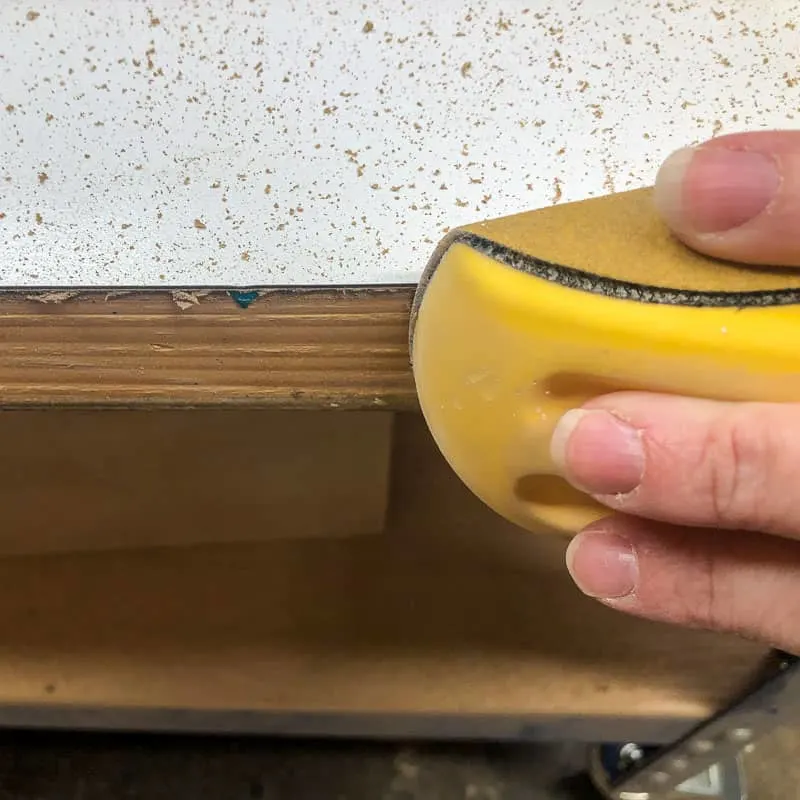 sanding edges of laminate sheet after installation