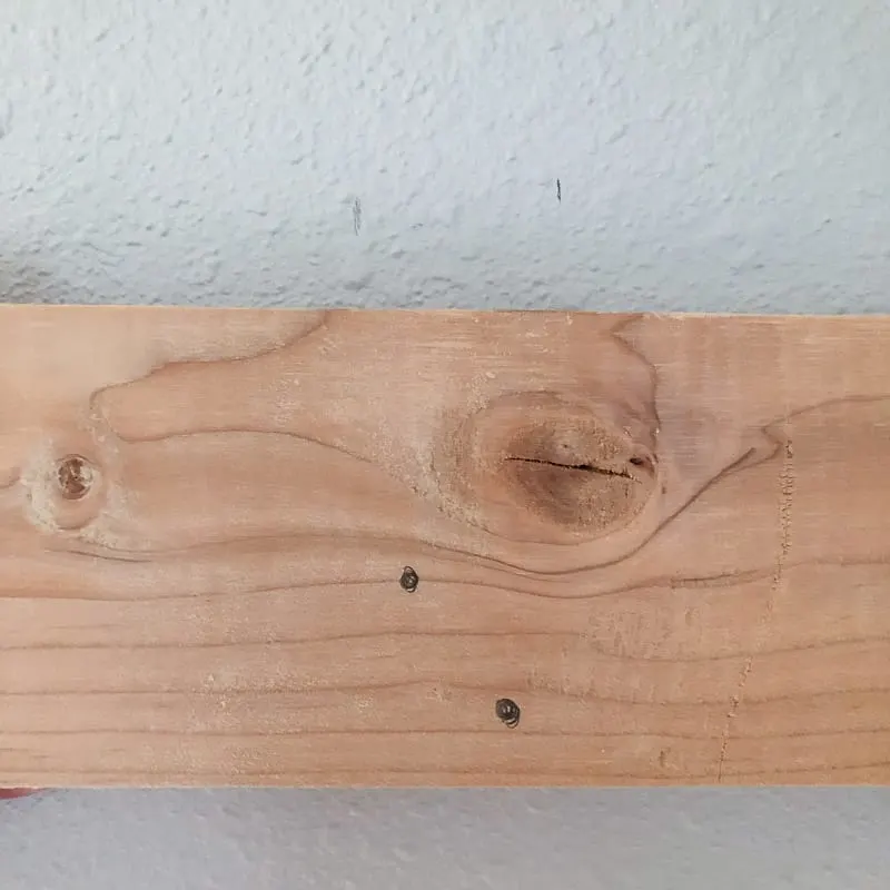 marking French cleat for holes by comparing to studs in the wall