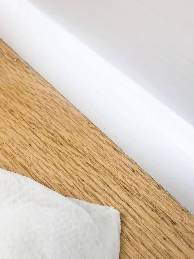 clean floor under painted baseboards
