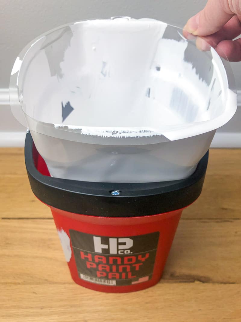 pulling out disposable liner from Handy Paint Pail