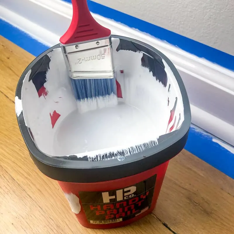 trim paint in Handy paint pail with paint brush attached to magnet on side